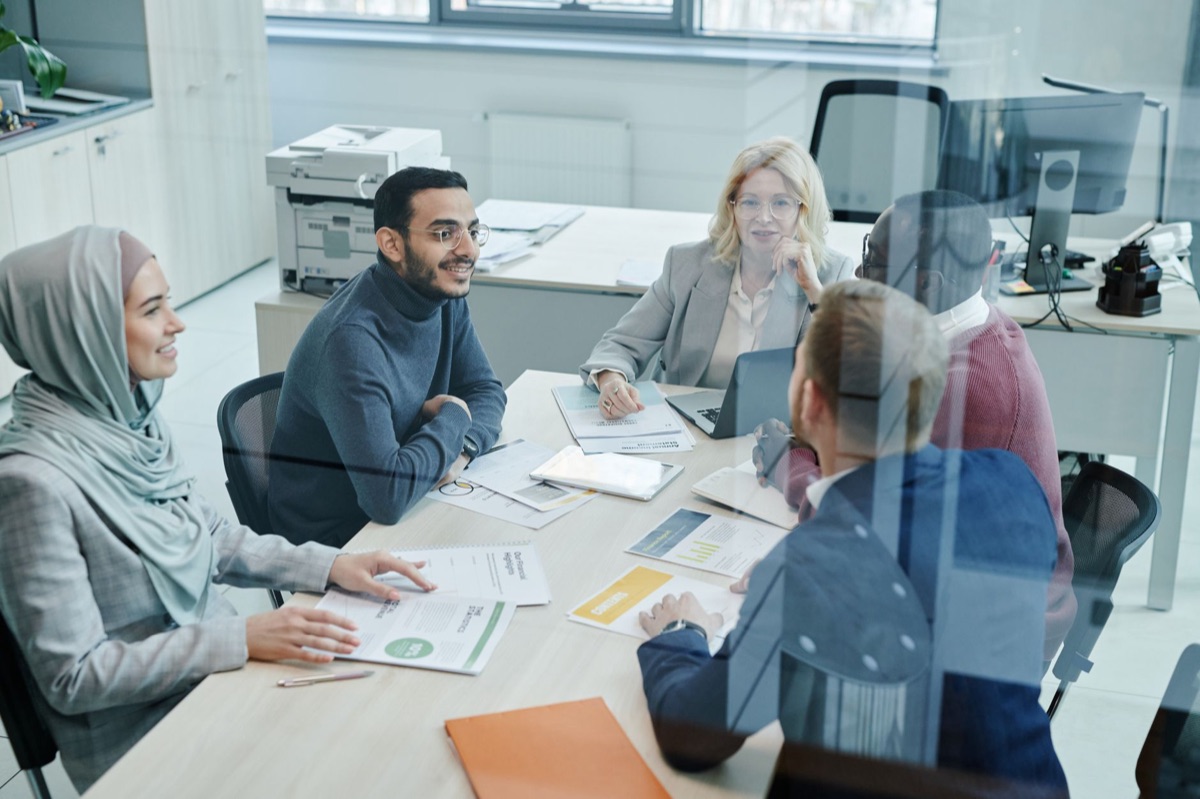 team discussing business model in conference room