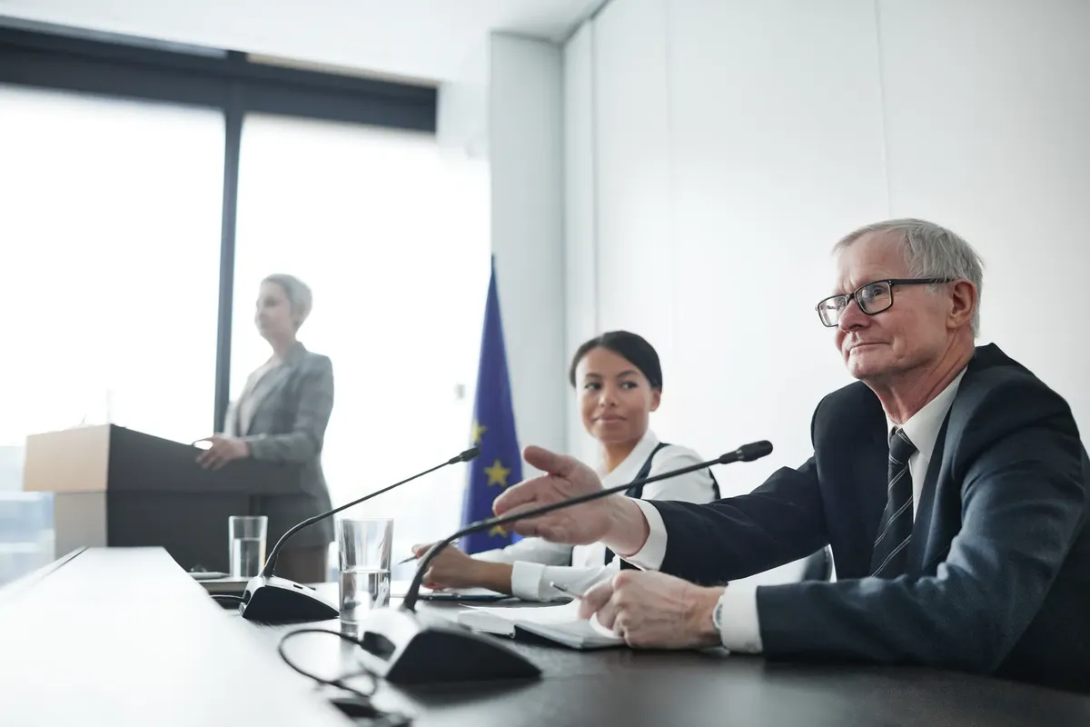 Panelists at an EU conference discussing law and diplomacy.