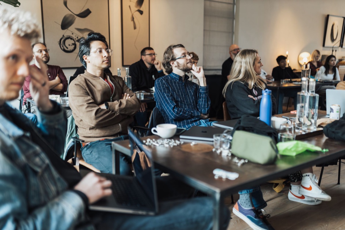 AI ethics conference attendees discussing censorship mechanisms