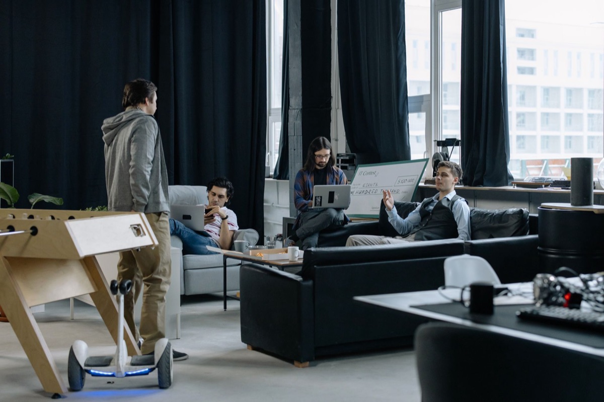 Modern AI startup office with whiteboards and computers